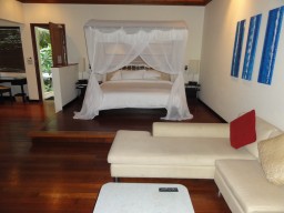 Deluxe Beachfront Pool Villa  - Room example with tasteful and comfortable interior.